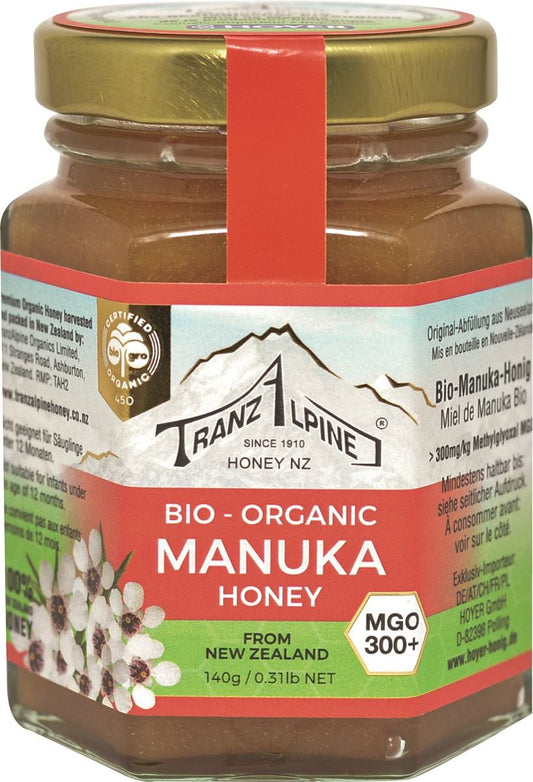 Manuka-Honig MGO 300+ BIO von TRANZALPINE in 140 g Glas, cremige Textur und natürliches Bio-Produkt.