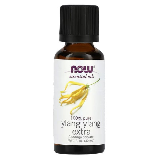 Ätherisches Ylang Ylang Öl von NOW FOODS in 30 ml Flasche, gelbe Blüten auf weißem Hintergrund