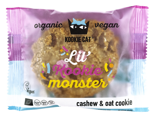 Veganer Kuchen von Kookie Cat mit bunten Schokoladengetränken und Vanille, 50 g, frisch gebacken und dekorativ auf einem Teller.