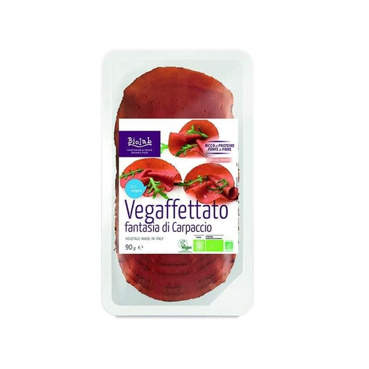 Bio Gemüse-Alternative Carpaccio von ECOR in 90 g, dünn geschnittene, bunte pflanzliche Gemüse-Alternative auf einem Teller.