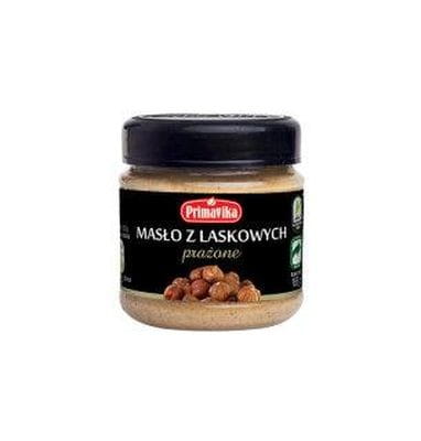 Geröstete Haselnussbutter von PRIMAVIKA in 185 g Glas, cremige Konsistenz und goldbraune Haselnüsse sichtbar.