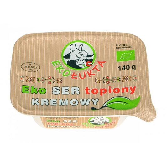 Bio Frischkäse von EKO ŁUKTA, 140 g, cremig und frisch, in einer weißen Verpackung auf einem Holztisch.