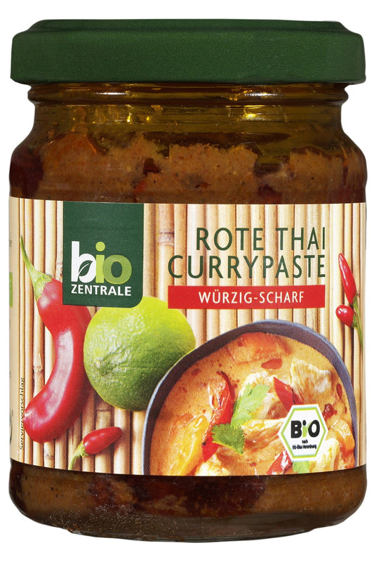 Rote Bio-Currypaste von BIO-ZENTRALE, 125g, in einer offenen Verpackung, zeigt die cremige rote Paste für asiatische Gerichte.