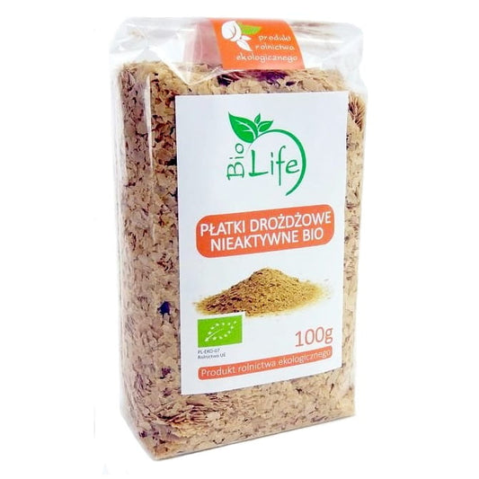 Bio Life Hefeflocken, 100g, grüne vegane Hefeflocken in einem transparenten Behälter, ideal für vegane Gerichte.