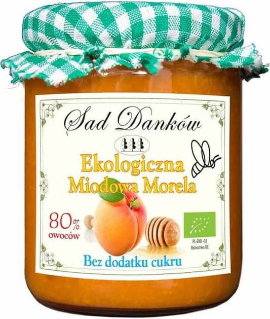 Löffel mit goldgelber Aprikosenhonig und Aprikosenmarmelade in 260 g Gläsern von SAD DANKÓW, fruchtig und aromatisch