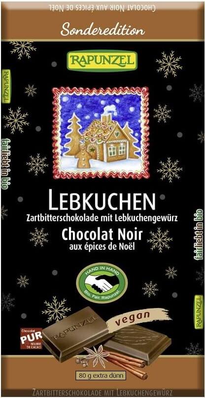 Bio Dessertschokolade mit Lebkuchengewürz von RAPUNZEL, 80 g, zeigt die schokolierte Oberfläche mit Gewürzstücken.