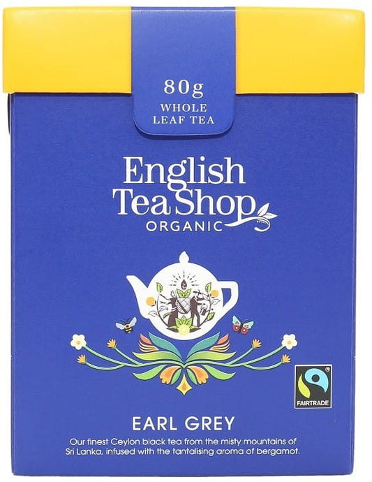 Bio Earl Grey loser Tee von ENGLISH TEA SHOP, lose Teeblätter für aromatischen englischen Tee, geöffnete Teetüte mit Teeblättern