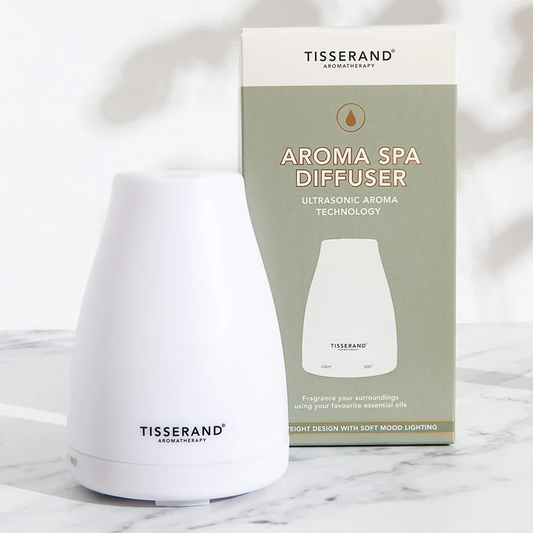 Diffusor für ätherische Öle von TISSERAND AROMATHERAPY mit 12 Steckern, weißes Design, ideal für Raumduft und Aromatherapie.