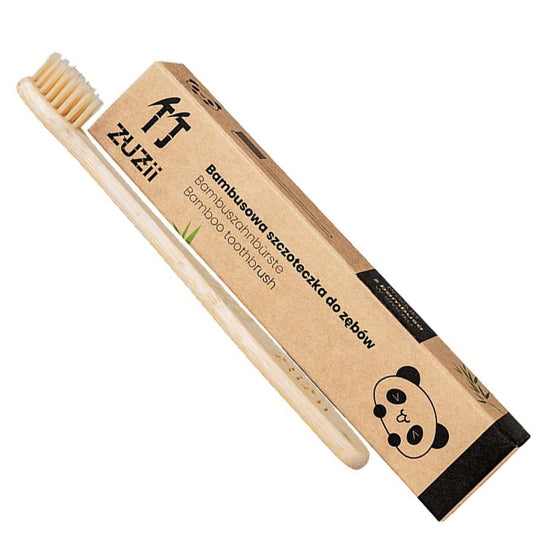 Beige Bambuszahnbürste für Kinder von ZUZII, mit bunten Borsten und ergonomischem Griff für kleine Hände.