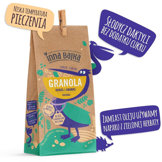 Hafer-Granola von INNA BAJKA mit Kokos und Ananas, 300 g, in einer Schüssel mit Granola, Kokosflocken und Ananasstücken.