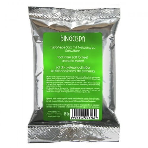 Fußschwitzsalz von BINGO SPA, 150 g, zeigt ein offenes Glas mit entspannendem Fußbad-Salz und frischen Kräutern.